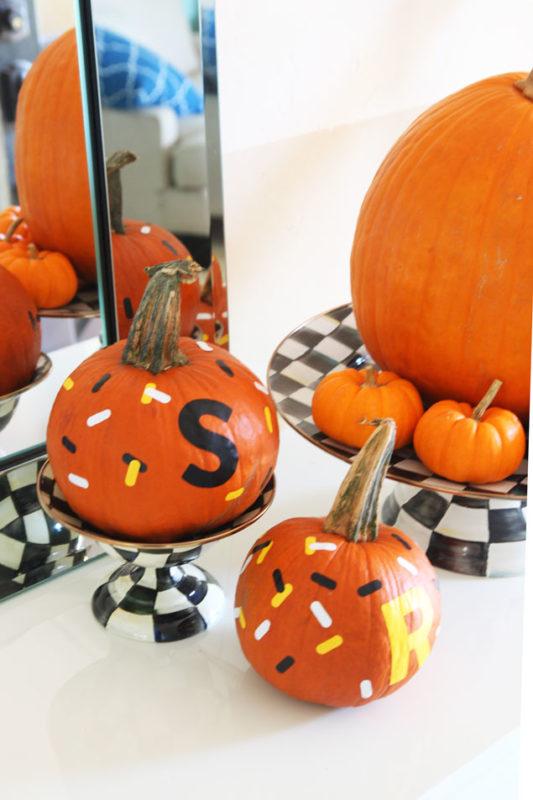 Custom monogrammed pumpkins with candy corn-inspired "sprinkles" - made with Cricut Explore - easy Halloween kid crafts - no mess craft - www.pencilshavingsstudio.com