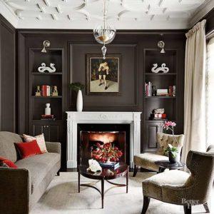 Gorgeous chic living room with dark chocolate paneled walls and a crisp marble fireplace. www.pencilshavingsstudio.com