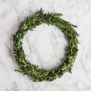 A simple and easy DIY for Christmas decor, this step by step guide will show you how to make this boxwood wreath. Simple, inexpensive, and a great Christmas craft for kids. See the full tutorial at www.pencilshavingsstudio.com
