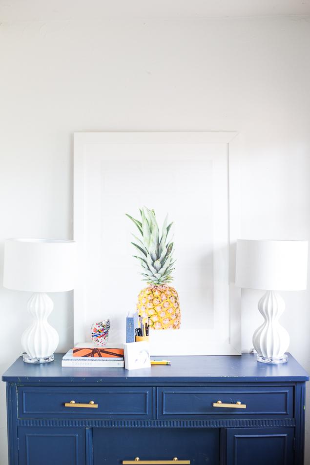 www.pencilshavingsstudio.com - corners of my home - framed pineapple print on vintage painted buffet flanked by a pair of gourd lamps.