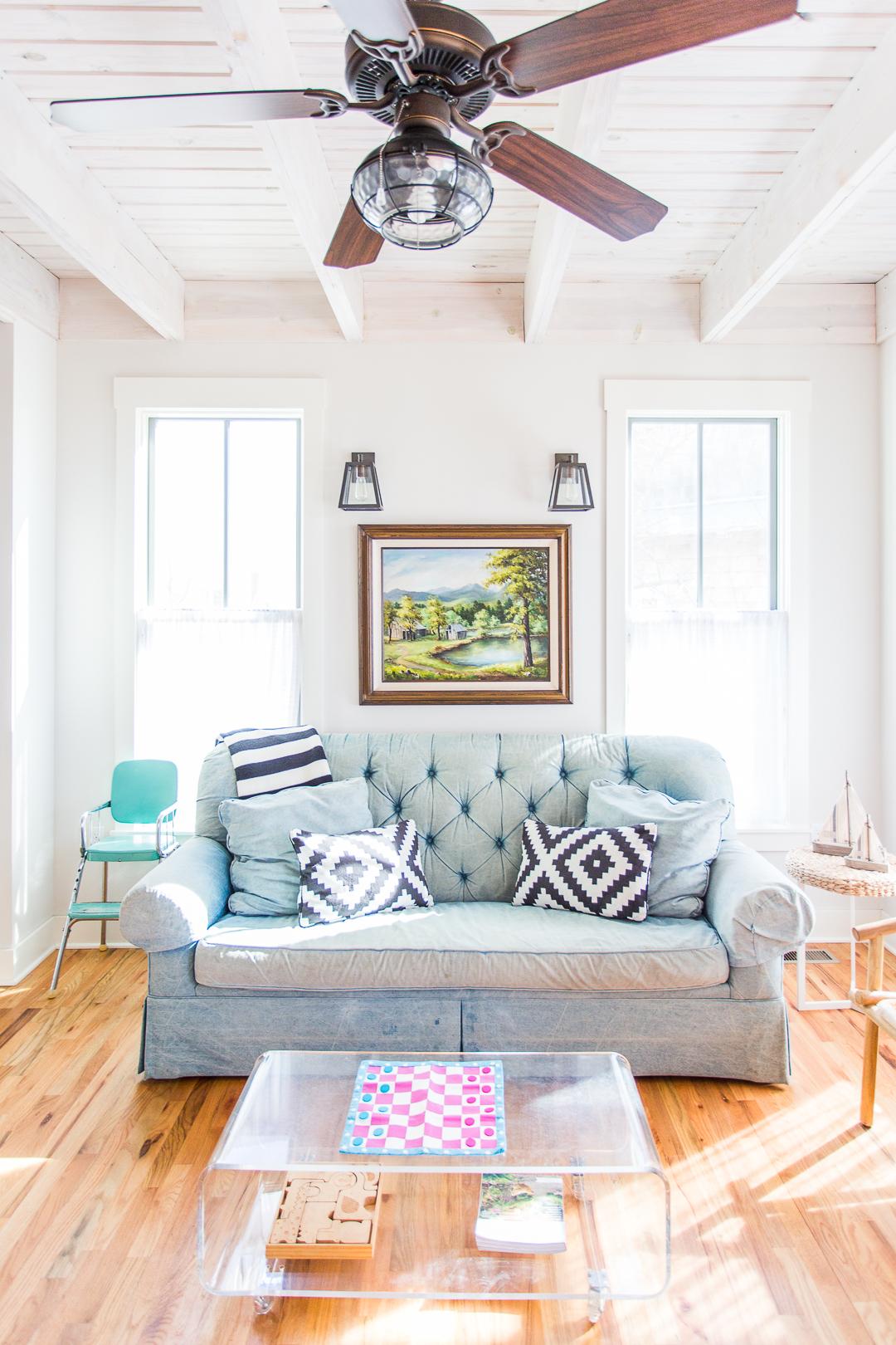 Check out today's home tour of this charming cottage in picturesque Carlton Landing on the shores of Lake Eufaula. This tiny home packs a major punch with smart design for small space living. With loads of vintage style, shiplap, a built in bunk room, and wood floors galore, you'll find plenty to inspire your next home design project. See the full tour at www.pencilshavingsstudio.com #newurbanism #tinyhouse #smallspaces #cottageliving #bungalow #southernliving #curbappeal #lakehouseliving #lakehouse #coastalliving #coastaldecor #eclecticstyle #eclecticdecor