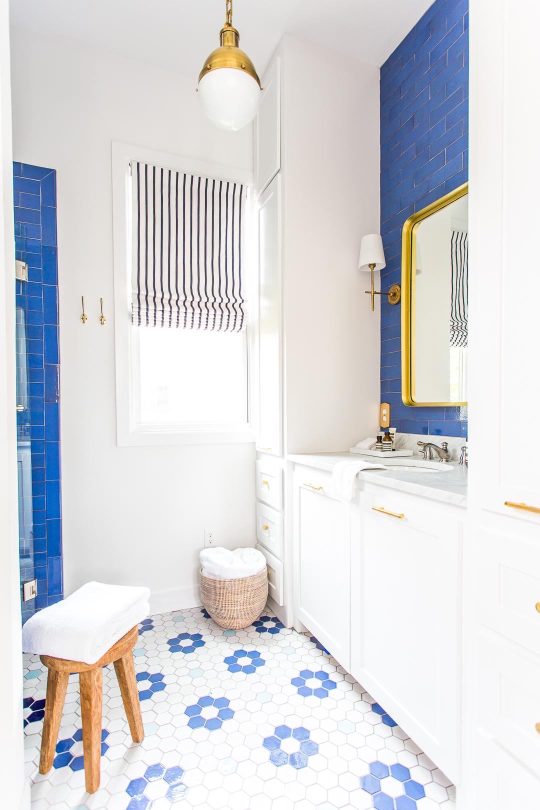 Lake house master bathroom reveal - handmade blue tile - Mercury Mosaic tile - Visual Comfort lighting - bathroom vanity - blue subway tile - cobalt subway tile - white cabinets - colorful master bathroom - hex tile floor - patterned hexagon floor tiles - www.pencilshavingsstudio.com